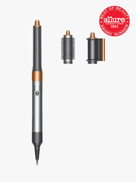 Dyson Airwrap Origin in branded components with best of beauty seal in the top right corner on a light gray background